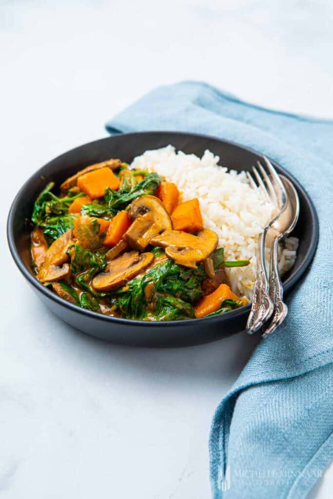 Plate of sweet potato curry and white rice