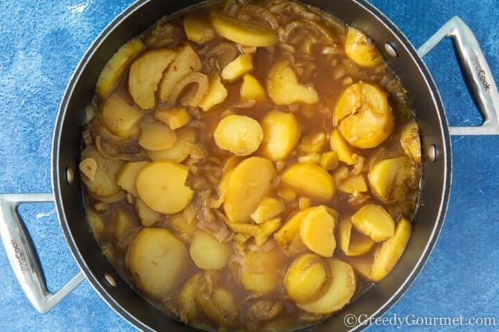 Potato fennel soup cooked in a cooking pot.