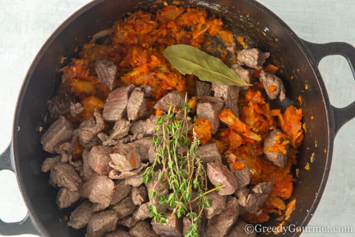 add beef, thyme and bay to pot.