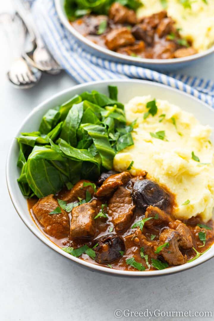 beef and Guinness stew with mash and greens.