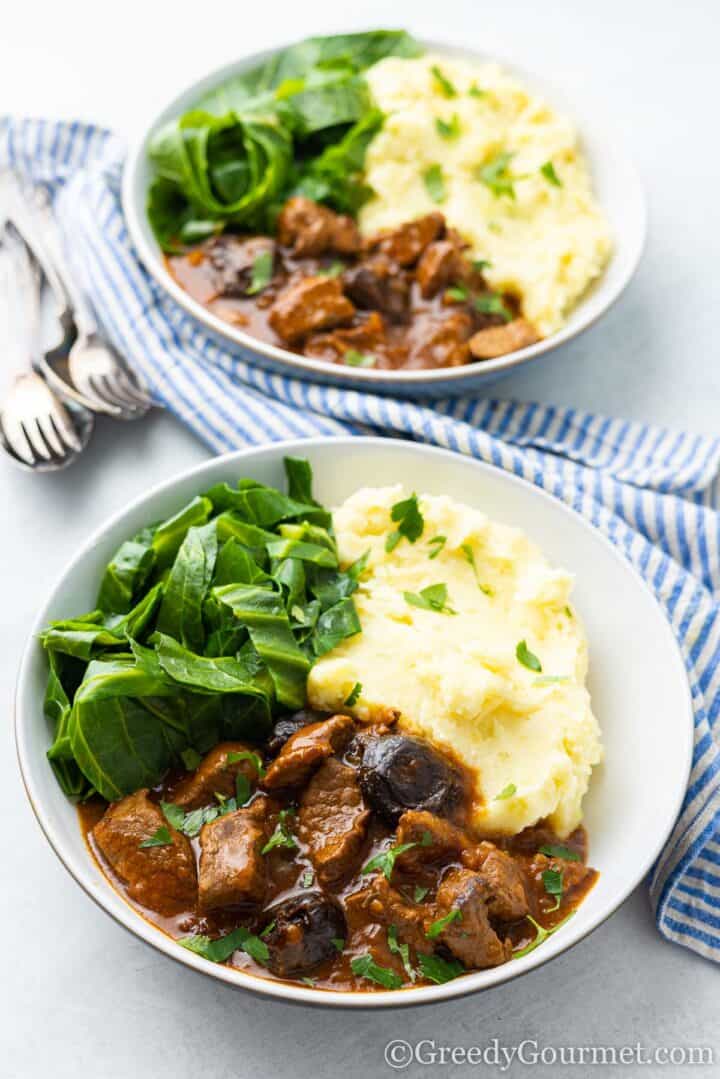 beef and Guinness stew with mash and greens.