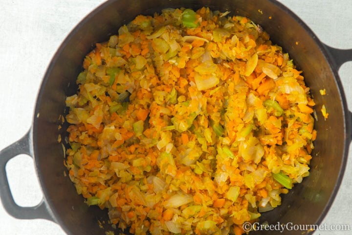 soften vegetables in large cooking pot.
