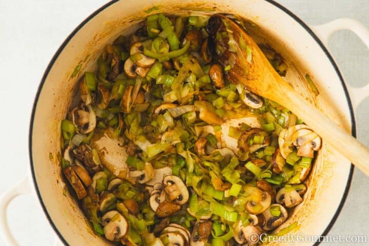 frying mushrooms and leeks.