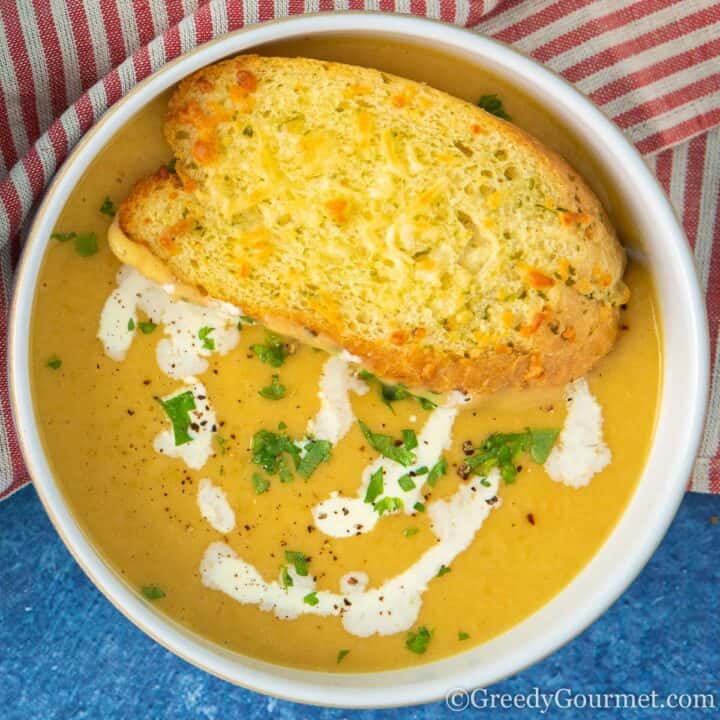 Navy bean soup in a bowl with bread.