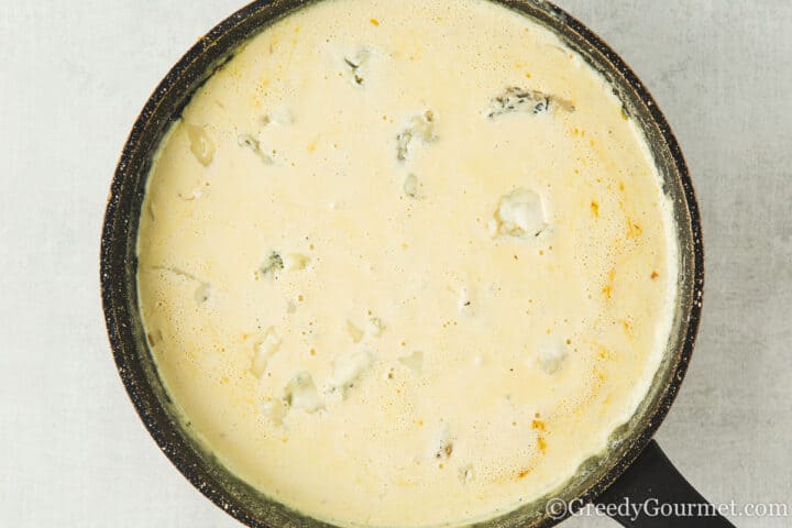 melt cheese in sauce.