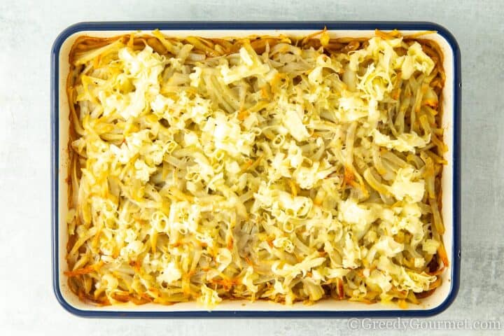 add grated cheese to casserole.