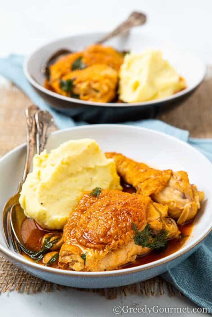 Bowl of chicken chasseur and mashed potatoes