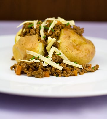 Baked Jacket Potatoes topped with Flavoured Beef Mince & Cheese