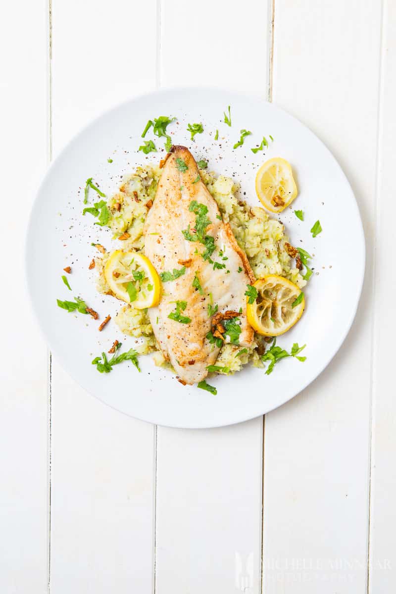 Pan-Fried Seabass With Garlic Lemon Butter Sauce And Spring Vegetables