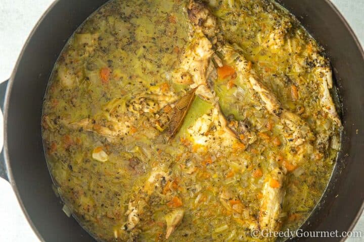 Add water to pot of herbs, chicken and mirepoix.