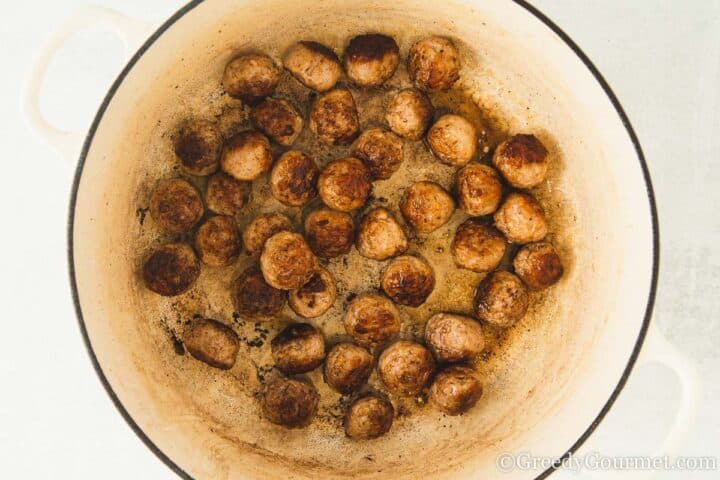 frying sausage pieces.