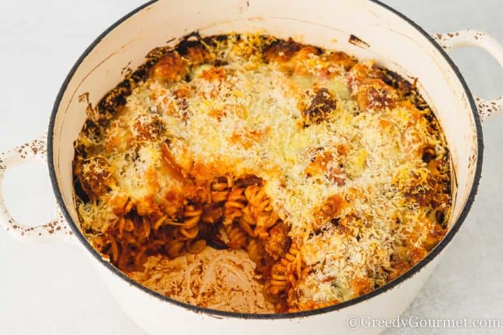pan of pasta bake with with a portion taken out.