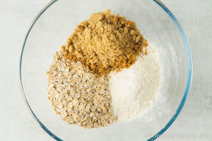oats, flour, sugar in a glass mixing bowl.
