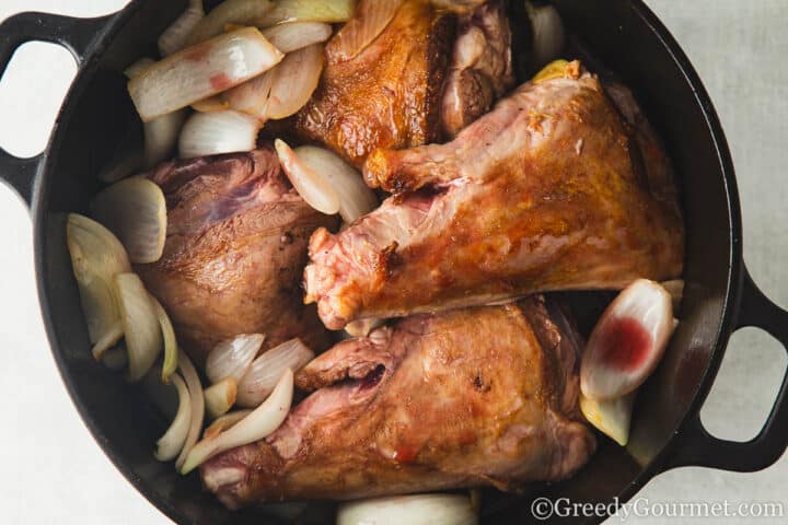 add lamb shanks to fried onion.