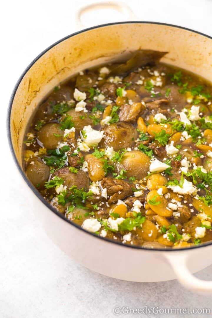 lamb stew in a large cooking pot.