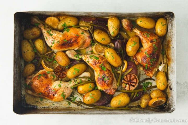 cooked lemon garlic chicken tray bake.