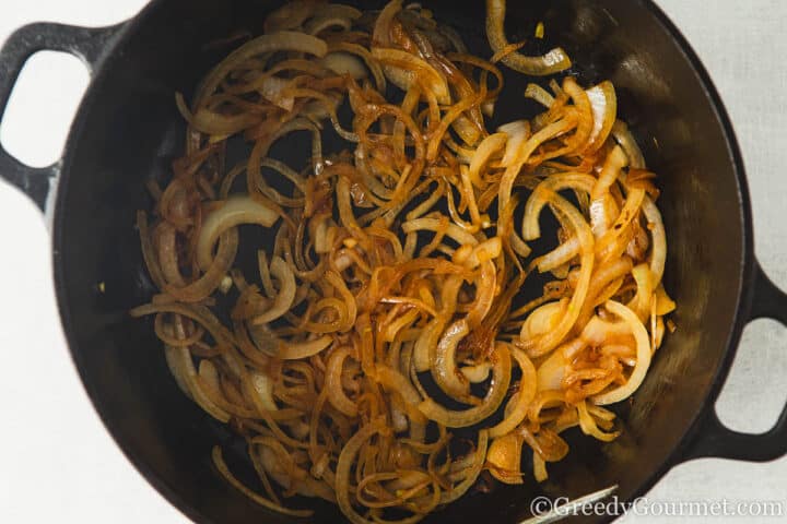 frying onions in a pan.
