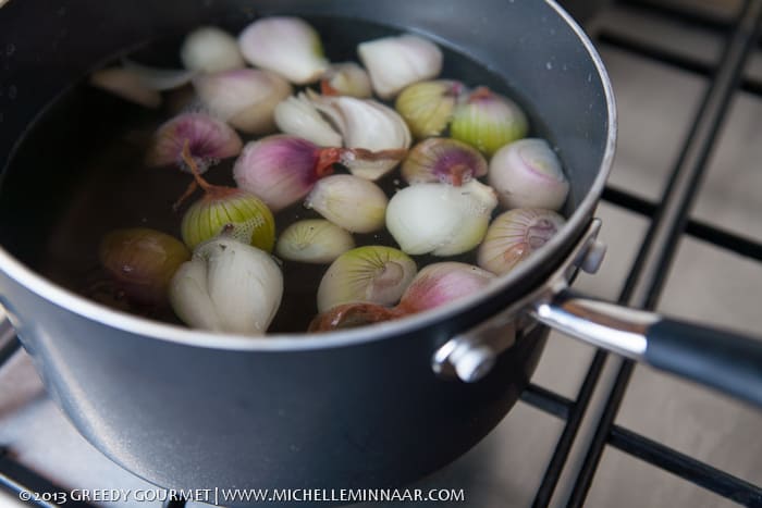 Shallots in a black pot