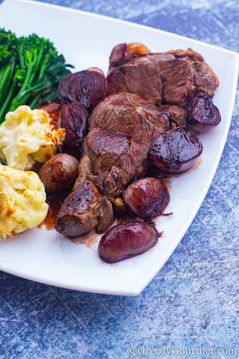 Full plate of lamb leg steak and sides