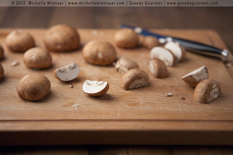 Halved mushrooms ready for sauce