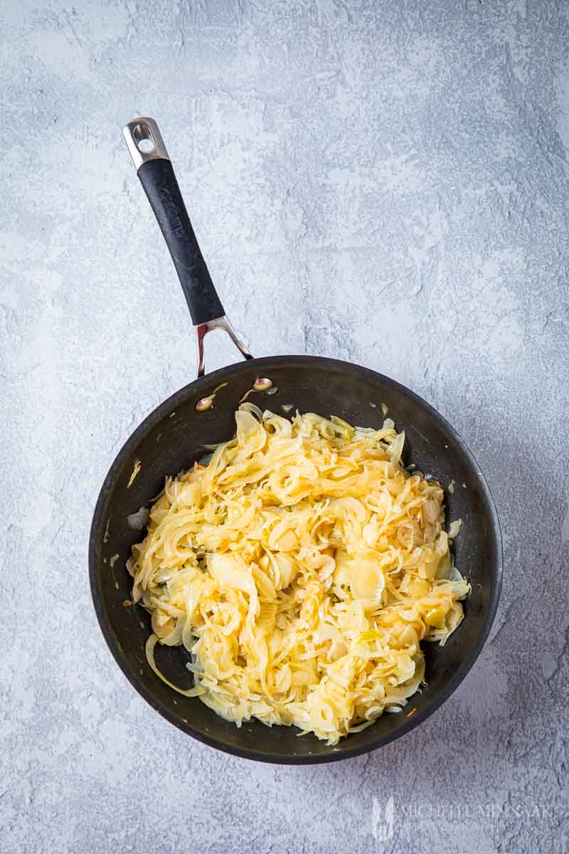 Onions sauteeing in a pan 