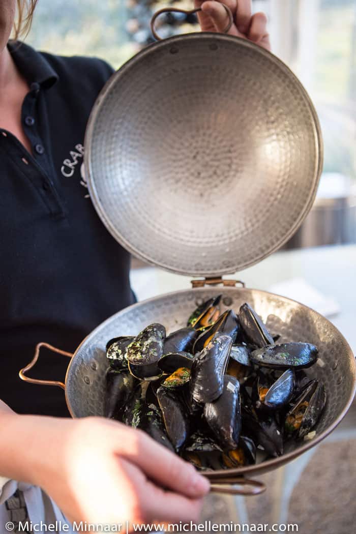 Cooking mussels in cataplana.