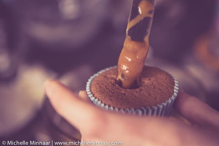 Filling cupcakes with caramel