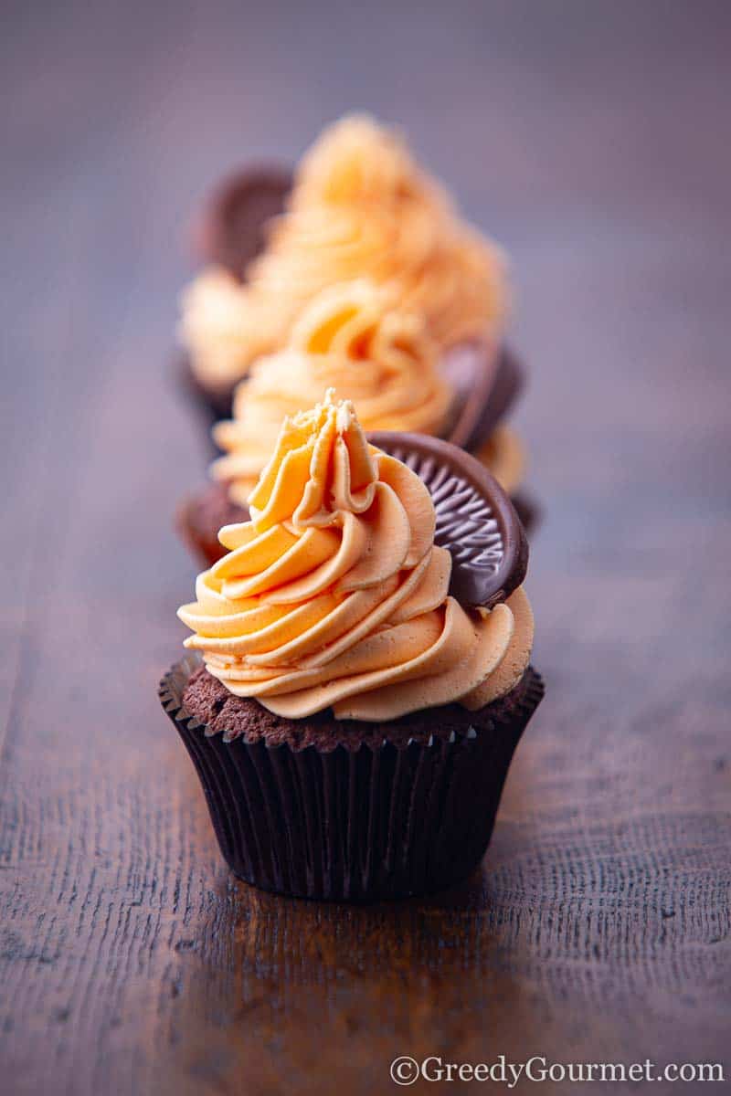 Chocolate cupcake with orange frosting