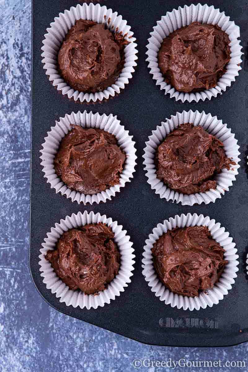 Cupcake tins filled with chocolate batter