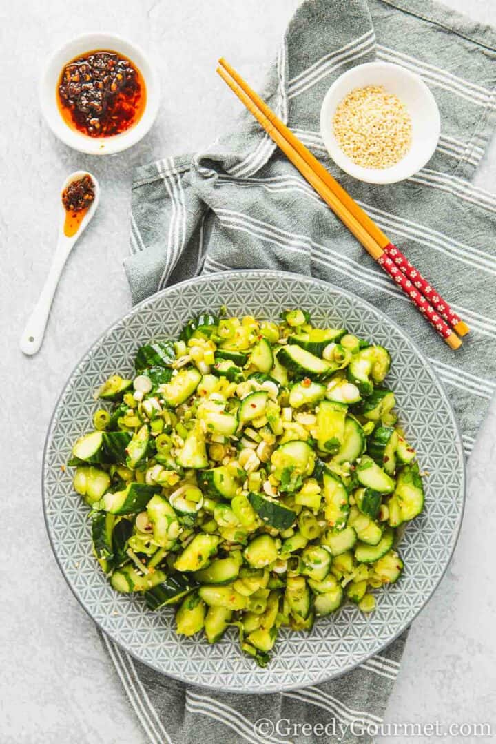 Smashed cucumber salad on a plate.