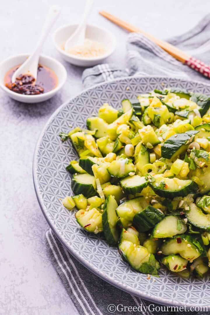 Smashed cucumber salad on a plate.