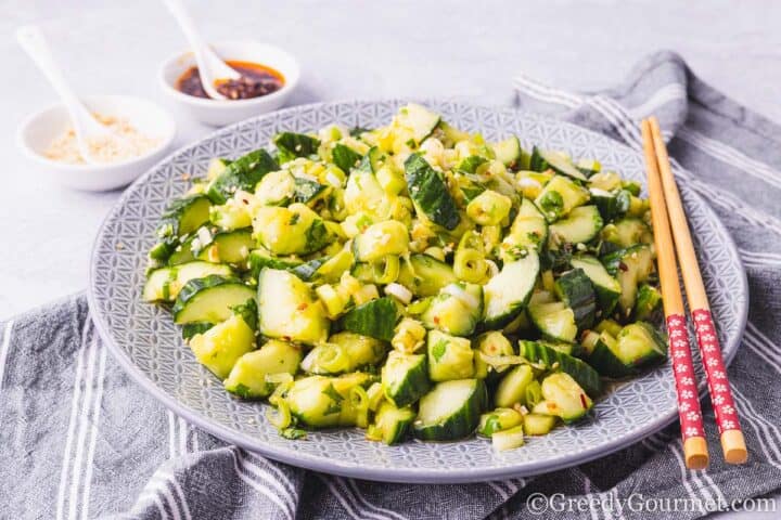 Smashed cucumber salad on a plate.