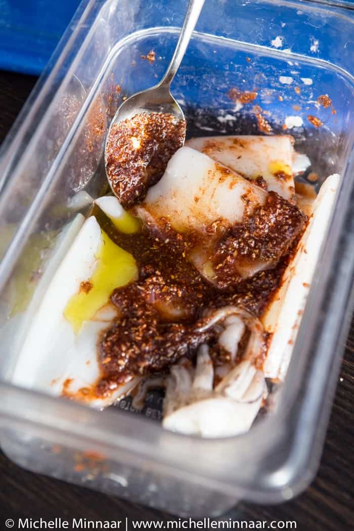 Marinating squid in a plastic bowl 