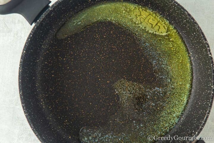 Melting butter in a frying pan.