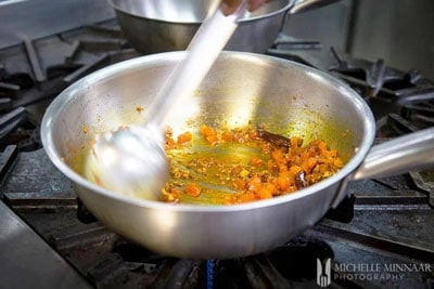 Tomatoes added to the curry sauce