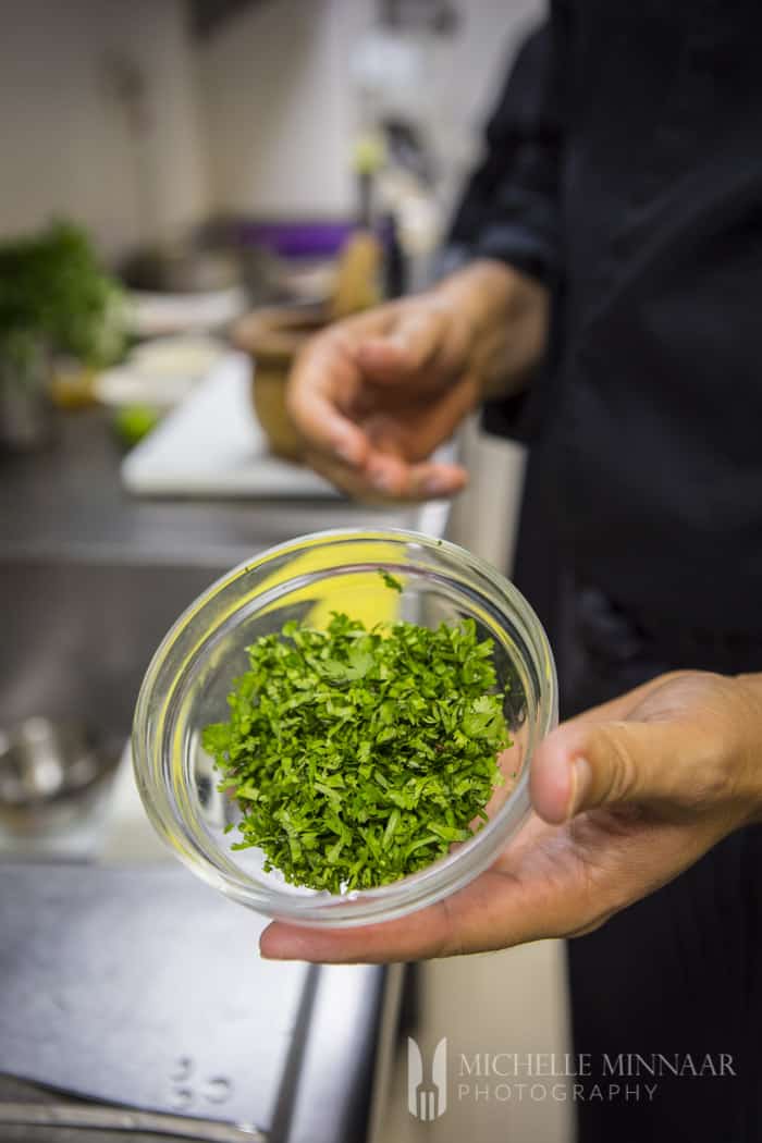 Cilantro in small glass bowl