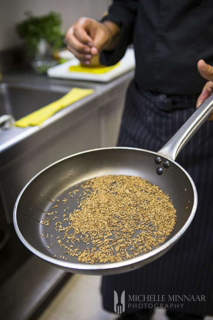 Whole cumin in frying pan