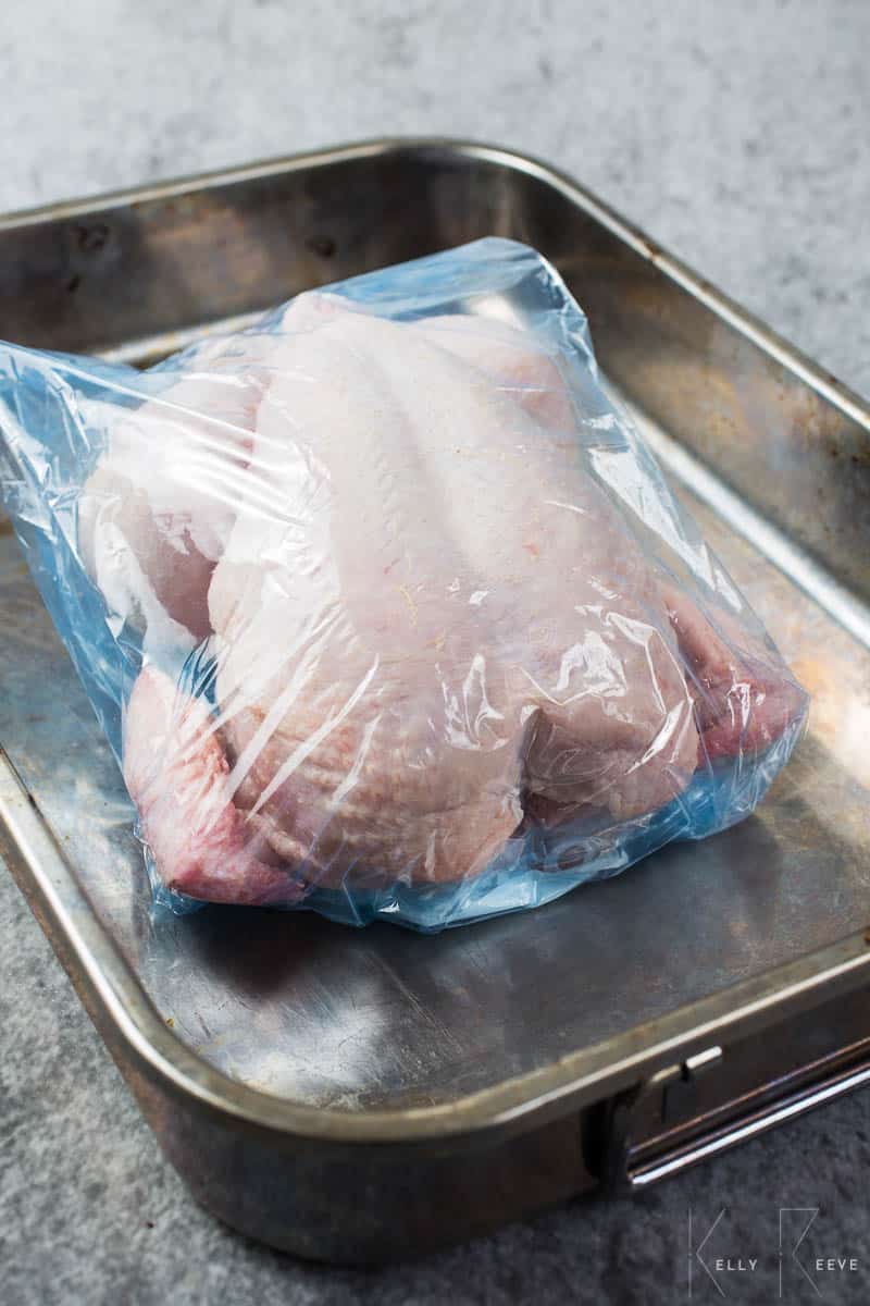 A whole chicken in a plastic bag