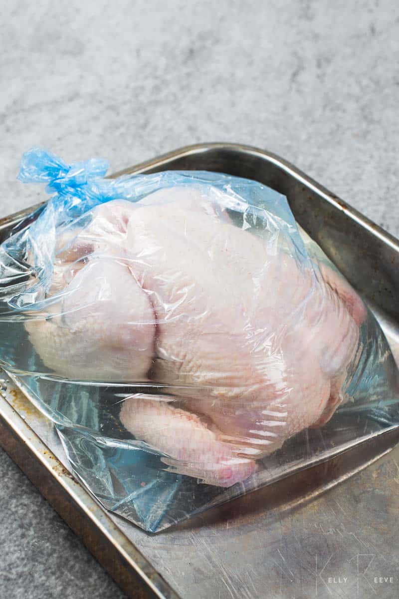 A raw chicken in a plastic bag 