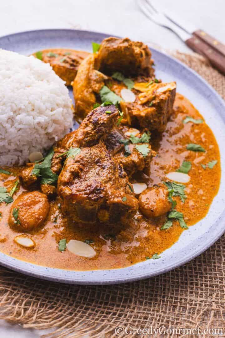 lamb chop curry served with rice.