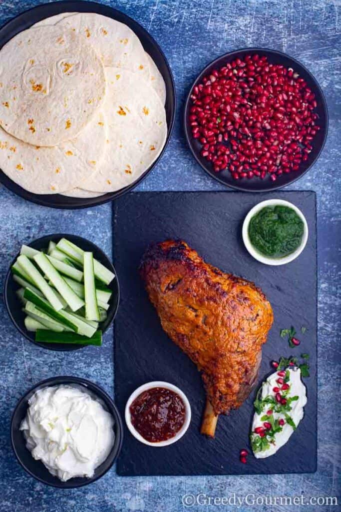 Full indian meal with a indian leg of lamb