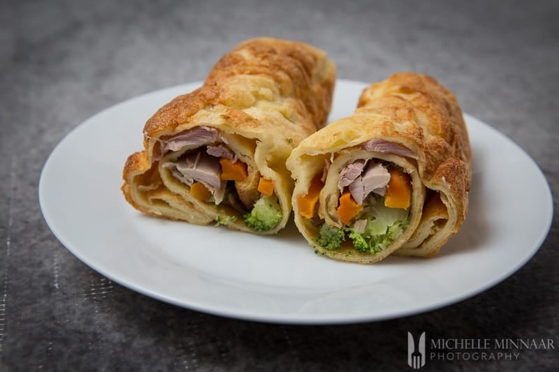 yorkshire pudding wrap cut in half on a plate 