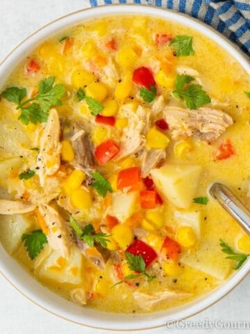 Bright yellow bowl of turkey chowder