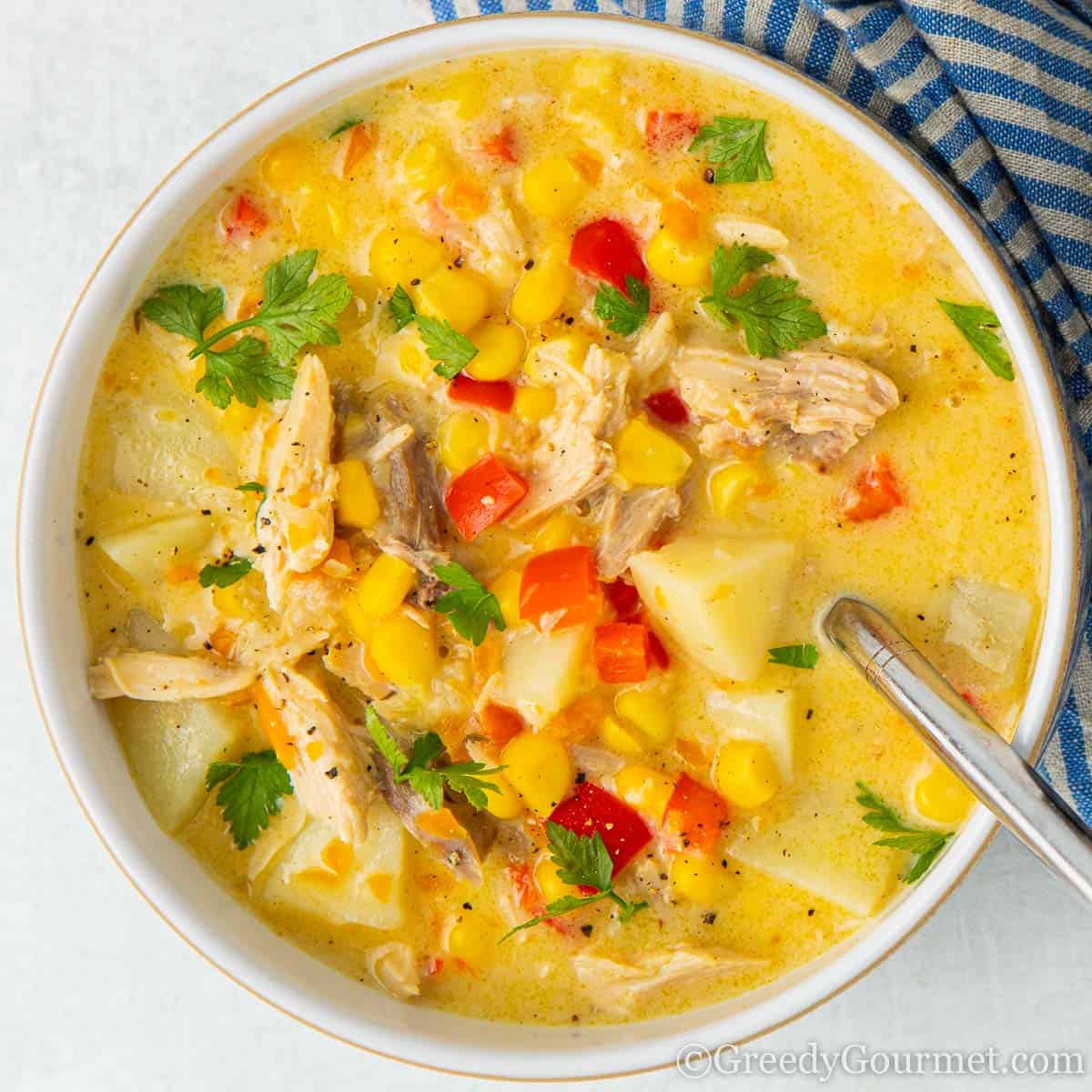 Bright yellow bowl of turkey chowder