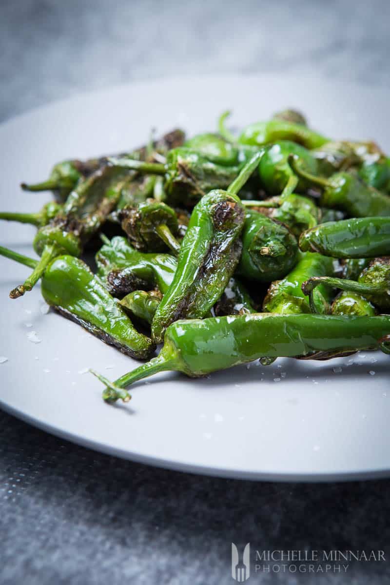 A close up of charred Pimientos de Padrón