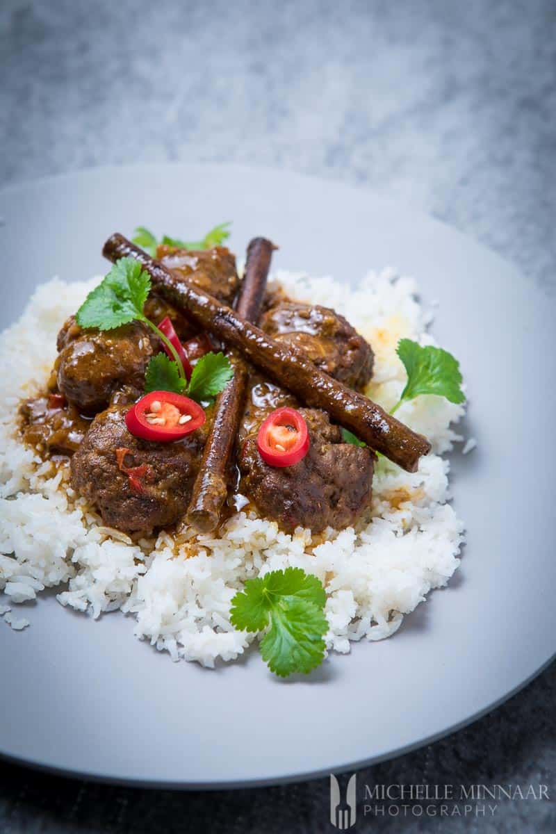 A plate of white rice and beef kofta on top