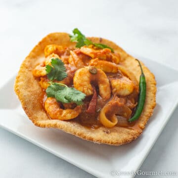 Close up of prawn puri in fried naan