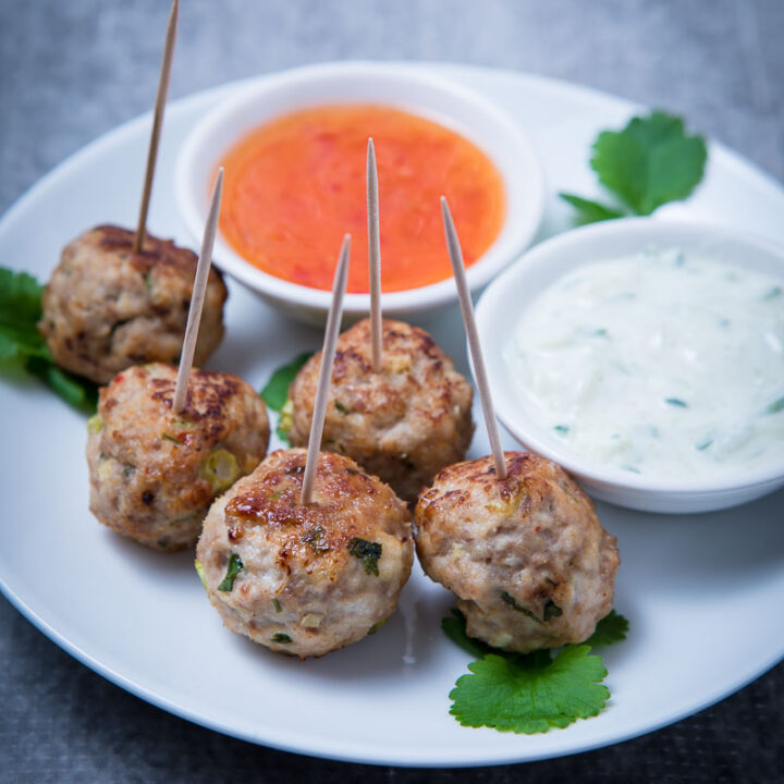 Thai Turkey Meatballs on a plate with dips