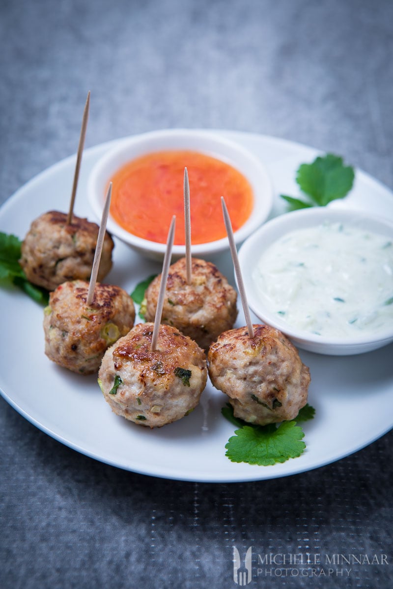 Thai Turkey Meatballs on a plate with dips