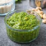 Close up shot of cashew pesto in a clear bowl